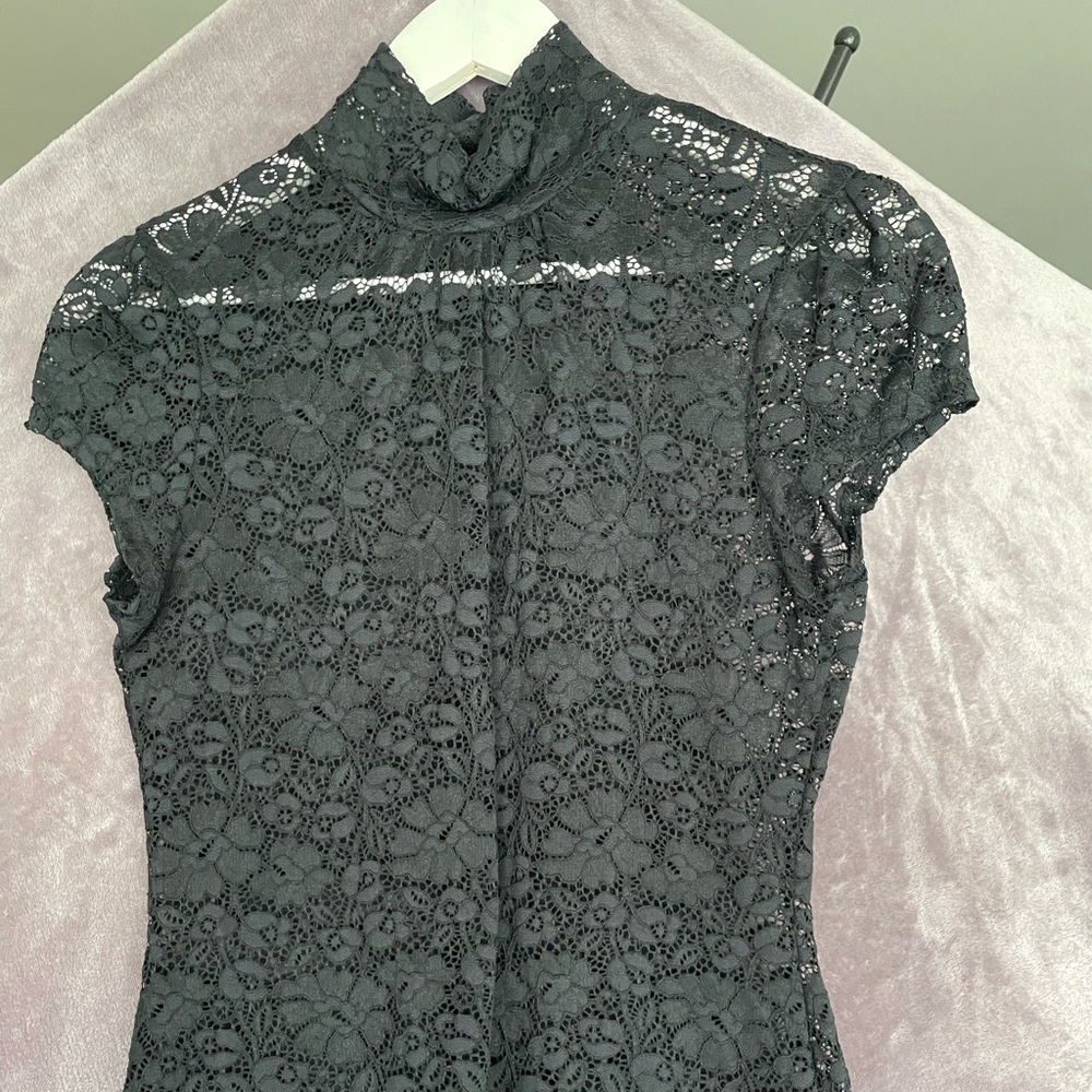 See-through sleeveless black lace top